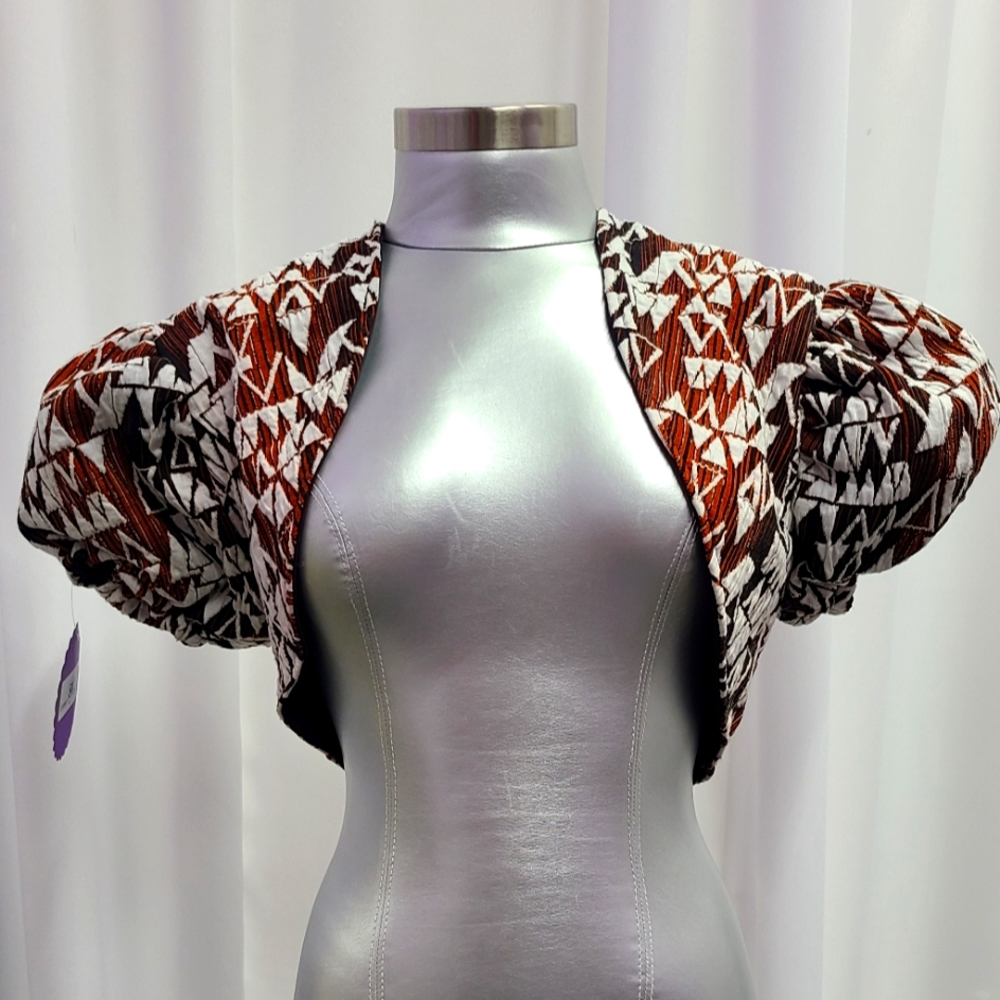 Designer Maggie Barry  Chic  Geometric print costom made puff sleeve shrug.
